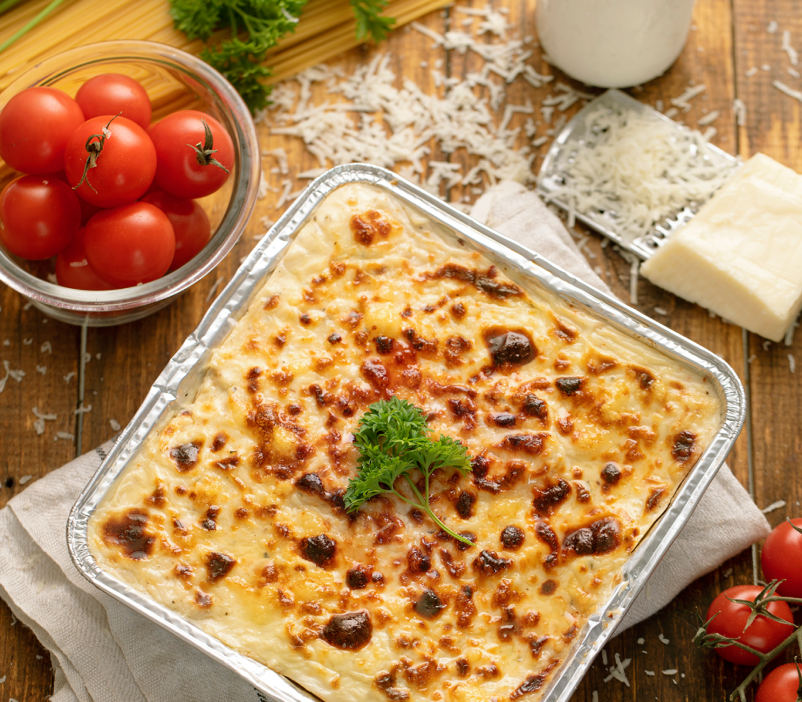 Baked creamy pasta casserole topped with melted cheese and herbs.