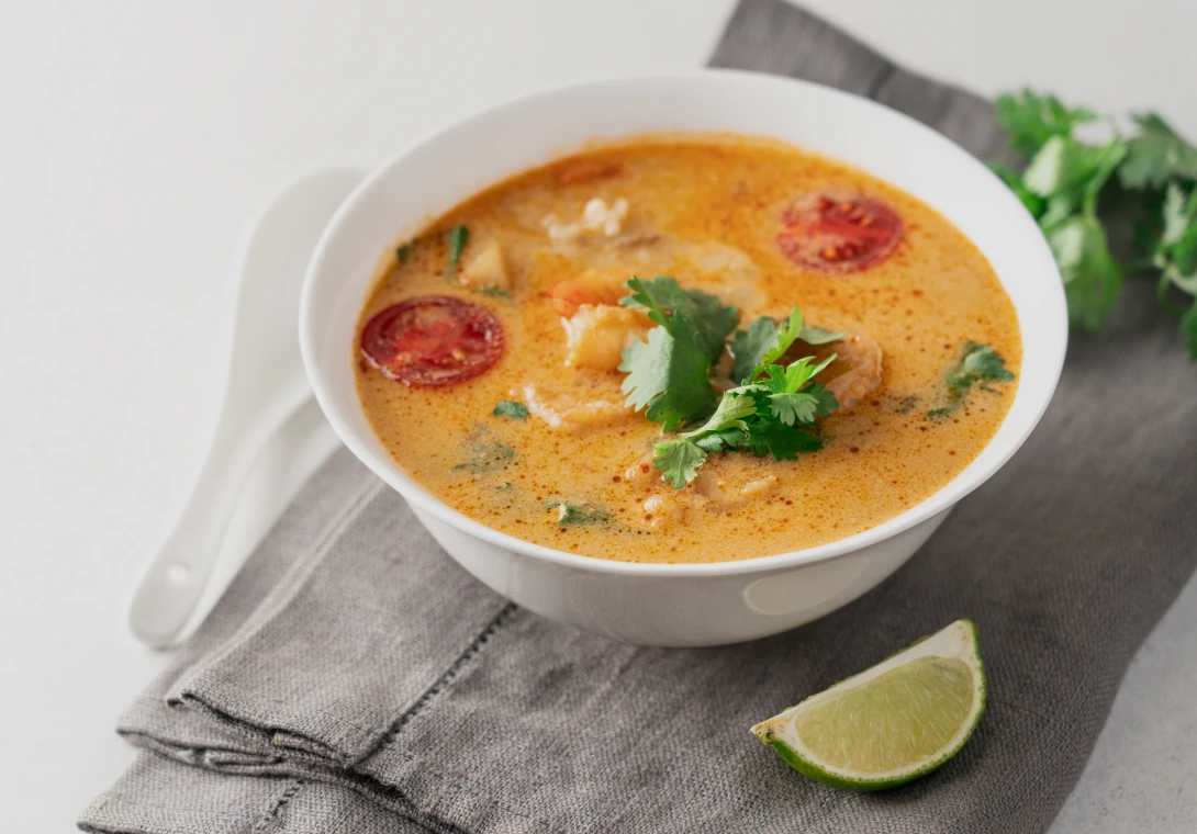 Spicy shrimp soup with lime and cilantro.